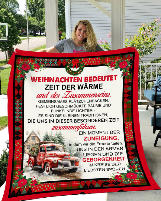 Festliche Wärme im Fokus: Kuscheldecke 'Weihnachten bedeutet Zeit der Wärme'